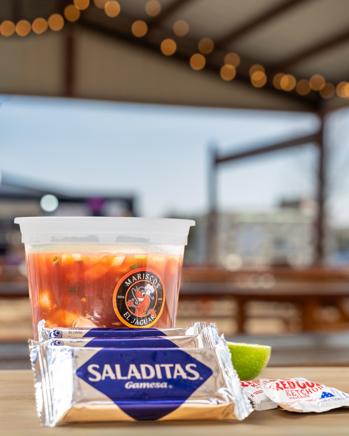 Mariscos El Jaguar branded ceviche cup with Saladitas — Austin restaurant lifestyle photography